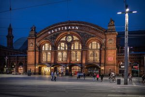 bremen station at night with a bicyclist 